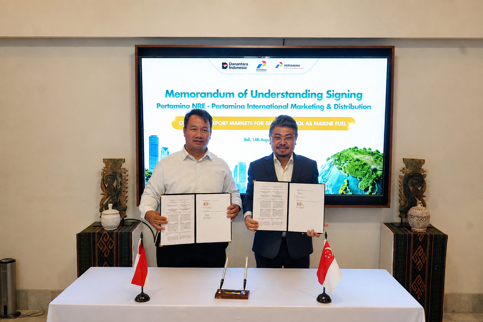 Pertamina NRE and PIMD representatives holding their signed Memorandum of Understanding